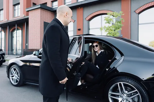 chauffeur opening car door